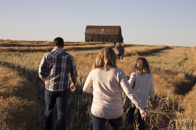 Family walking through field